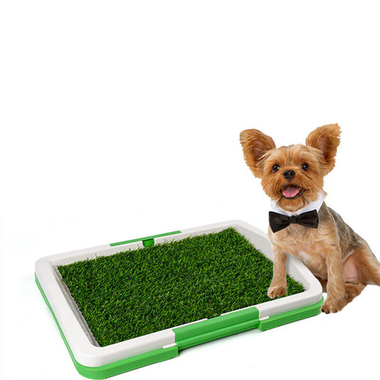 Indoor dog toilet mat with an artificial grass surface and drainage tray